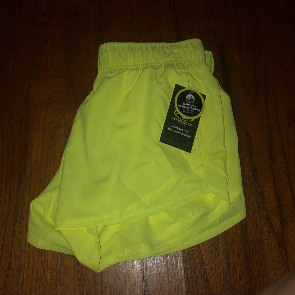 New with tags! Neon yellow sport shorts with pockets